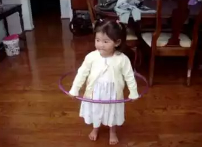 little_girl_tries_to_hula.png